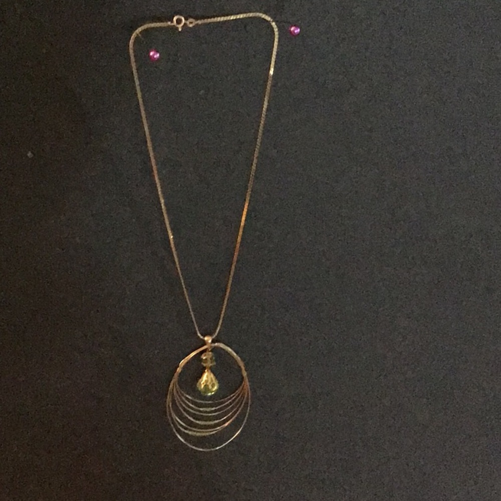 Gold necklace with peridot colored crystal